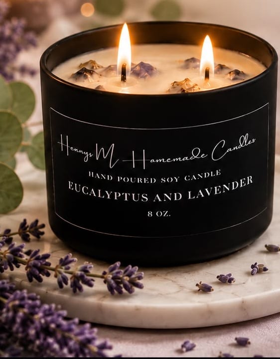 Eucalyptus and Lavender candle burning on marble, surrounded by fresh lavender